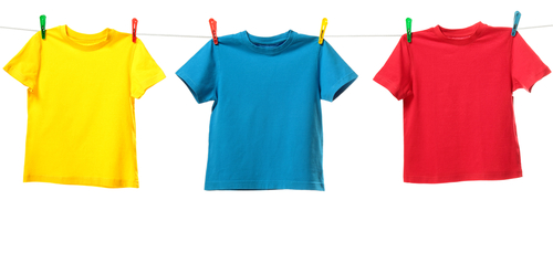 Three colorful shirts hanging on the clothesline