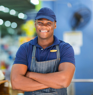 supermarket cashier standing at checkout