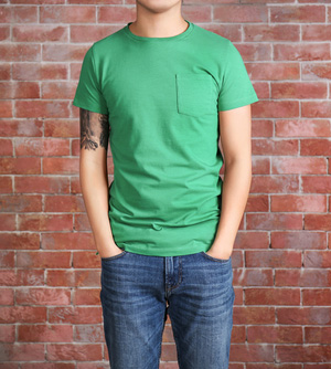 Young man in blank green t-shirt