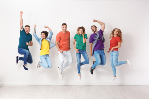 Group of young people in jeans and colorful t-shirts