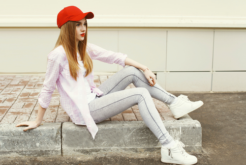 girl wearing a shirt and red cap
