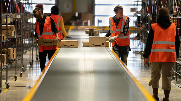 amazon warehouse workers using conveyer