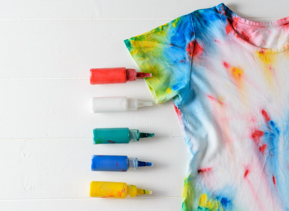 tie dyed t shirt with bottles around it