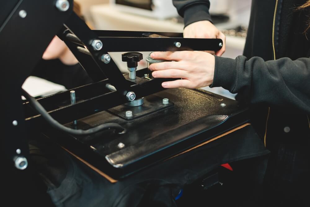 A heat press machine being used